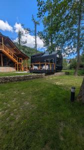 a house sitting on top of a lush green field at Agroturystyka SPA in Zelków