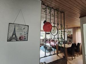 a dining room with a table and a dining room with the eiffel tower at Flumserberg pur, Auszeit am Walensee in Flums