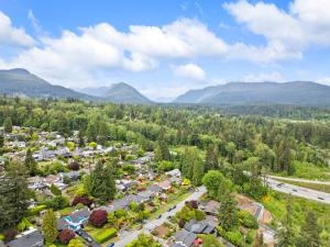 an aerial view of a town with mountains in the background at North Shore Luxe Villa in North Vancouver