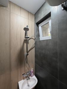 a bathroom with a sink and a shower at Boho style house Varna in Varna City +26 photos