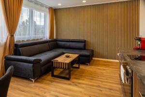 a living room with a couch and a table at M4 Apartment New in Freiburg im Breisgau