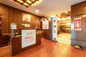 a lobby of a salon with a sign on the wall at Panaji Residency in Panaji