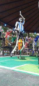 a skeleton on a merry go round at a carnival at Estadio Azteca Banorte Suites in Mexico City