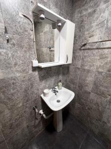 a bathroom with a sink and a mirror at Salt & Sea in Sykia Chalkidikis