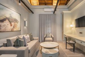 a living room with a couch and a table at Mokuti Etosha in Namutoni