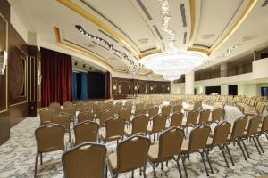a conference room with rows of chairs in a row at Crystal Sunset Pearl Collection - Ultimate All Inclusive in Side +158 photos