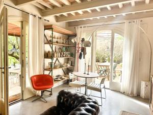 a living room with a couch and a table at Residenza dell'Orto - Residenze Tonnina Group in Guardistallo