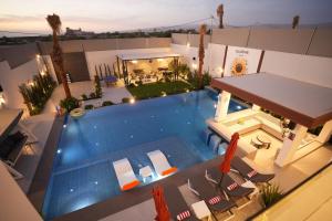 an overhead view of a swimming pool in a house at Blooms Villa in Al Rama