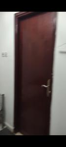 a close up of a wooden door in a room at Living room in Muscat