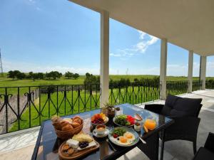 a tray of food on a table on a patio at Villa Garden and Pool near Airport in Norakert