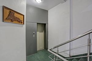 a staircase in a building with a picture on the wall at Hotel O Dps Inn in Allahābād