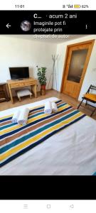 a large bed with two pillows on top of it at Casa Cami in Jurilovca