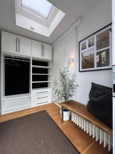 a living room with a large tv and a couch at Apartment am Freitagsbach in Celle