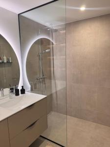 a bathroom with a shower and a sink at Mõisavälja apartment in Rakvere +9 photos