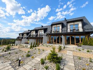 a house on the hill with a view at Golden Trio Villas in Ząb