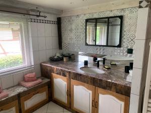 a bathroom with a sink and a mirror at Ferme Alsacienne in Soppe-le-Haut +14 photos
