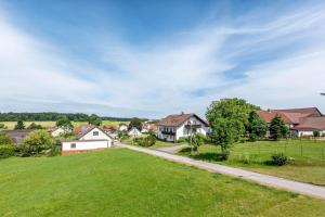 a residential neighborhood with houses and a road at Haus Schönblick in Amorbach