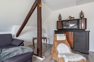 a living room with a couch and a table at Haus Schönblick in Amorbach