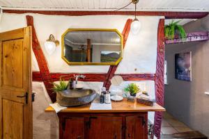 a bathroom with a sink and a mirror at Heimat Liebe_Scialla in Herbolzheim +36 photos