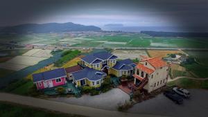 arial view of a large house with a yard at Buan lemon terrace pension in Buan