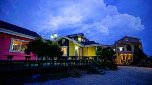 a group of houses are lit up at night at Buan lemon terrace pension in Buan