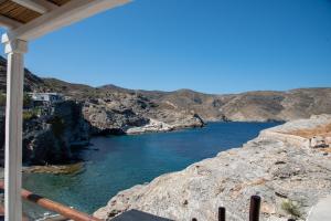 a view of a body of water from a balcony at Aegean Whisper Koumelas in Mamádhos