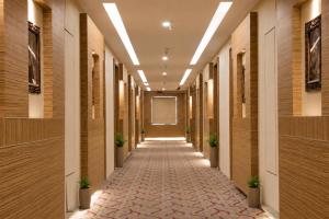a hallway of a building with at Landmark, Rewa - AM Hotel Kollection in Rewa