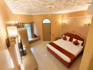 a bedroom with a large bed in a room at Ray of Maya near to taj mahal in Agra