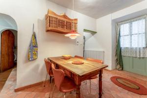 a dining room with a wooden table and chairs at Amour de Provence in Nyons