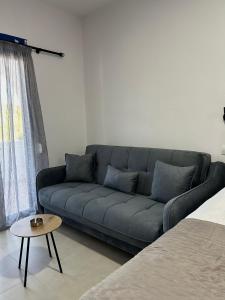 a living room with a couch and a table at Salt & Sea in Sarti +12 photos