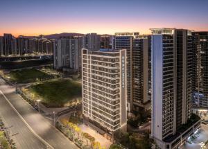 an aerial view of a city with tall buildings at Mercure Kunming Wujiaba in Kunming