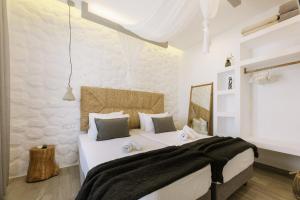 a bedroom with a large bed in a room at Hidden Gem Villa Aqua Marine - Sea View - Mikri Vigla Beach in Naxos Chora