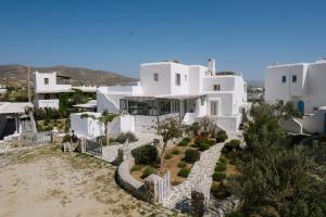 a view of a villa with white buildings at Hidden Gem Villa Aqua Marine - Sea View - Mikri Vigla Beach in Naxos Chora