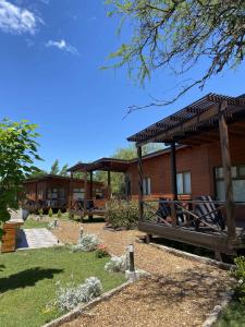 a resort building with a pavilion and a garden at Cabañas Boutique Pipi Cucu in Colón
