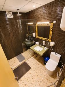 a bathroom with a toilet and a sink and a mirror at Ray of Maya near to taj mahal in Agra +39 photos