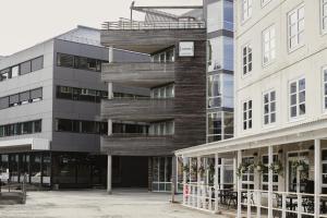 an apartment building with a spiral staircase at Home Hotel Aurora in Tromsø