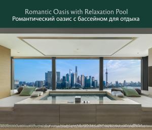 a living room with a view of the city at Banyan Tree Shanghai On the Bund in Shanghai