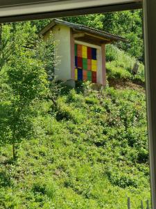 a house with a colorful painting on the side of it at Mirna zelena dolina in Šentilj +3 photos