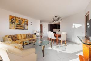 a living room with a couch and a table at Lets Holidays INCREDIBLE APARTMENT WITH AMAZING VIEWS in Tossa de Mar