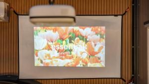 a sign on a wall with a picture of flowers at Gapyeong Dangdangi Pet Pension Green in Gapyeong +2 photos