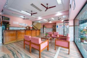 a waiting area in a hospital with chairs and tables at Margao Residency in Madgaon
