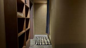 a door to a closet with a rug on the floor at MAGATAMA.INN in Sumoto +48 photos