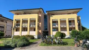 a building with bikes parked in front of it at Marina Fiorita in Grado