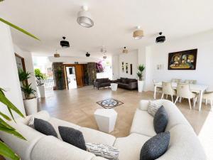 a living room with a couch and a table at Salinas Hotel in Gümbet