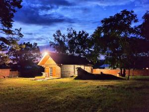 a small house with a light on top of it at Хатуля in Oleshnya +9 photos