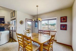 a dining room with a wooden table and chairs at Lookout Ridge 63 in Dillon