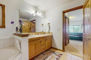 a bathroom with a sink and a mirror at Lookout Ridge 63 in Dillon +47 photos