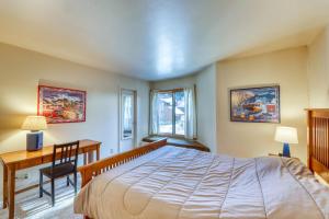 a bedroom with a bed and a desk and a table at Wild Irishman 1080 in Dillon