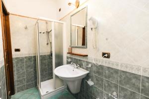 a bathroom with a sink and a shower at Agriturismo La Baita in Agerola +86 photos