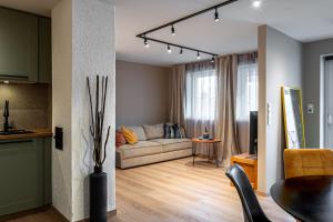 a living room with a couch and a table at Mountain View Apartment, Free Parking, Hiking Nearby in Ålesund